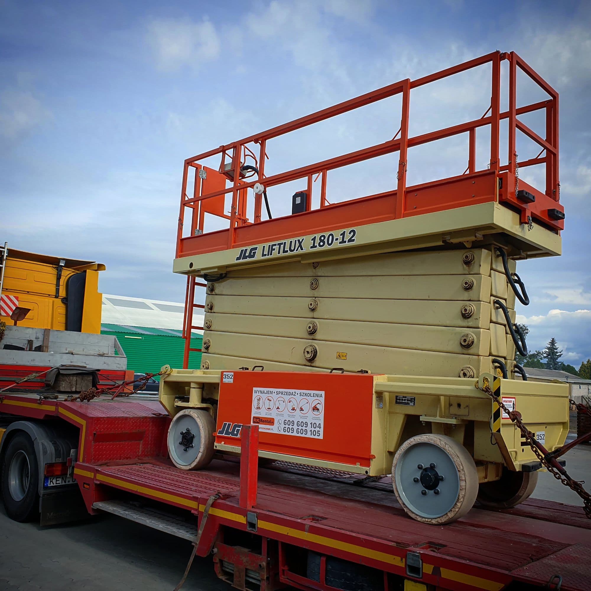 Delivery of a tall JLG Liftlux 180-12 electric scissor lift (20 m) on an RK Rental low-loader to a customer