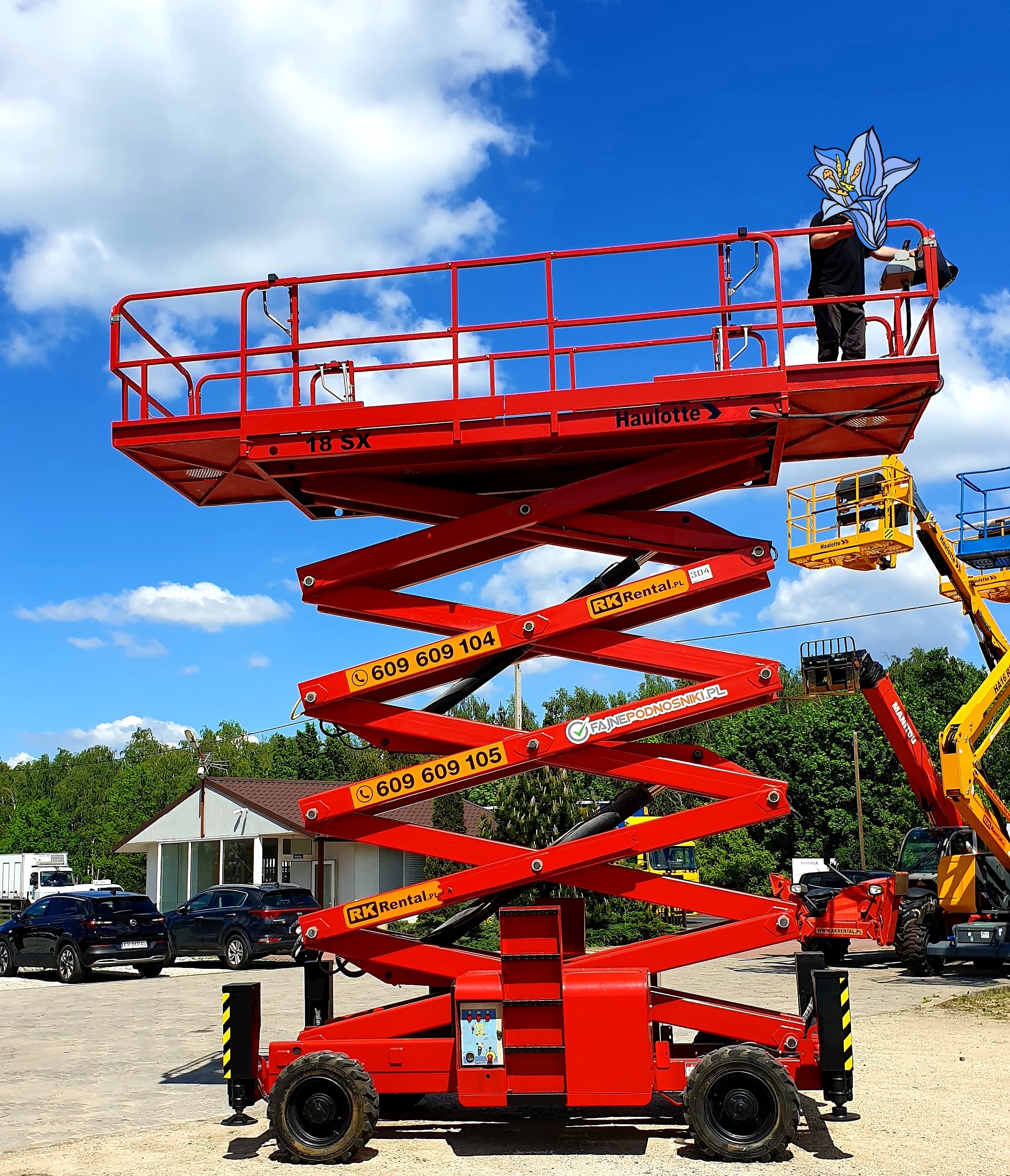 Rented Haulotte H18SX diesel 4×4 rough terrain scissor lift (18 m) from RK Rental prepared at the yard before delivery to a customer in Inowrocław