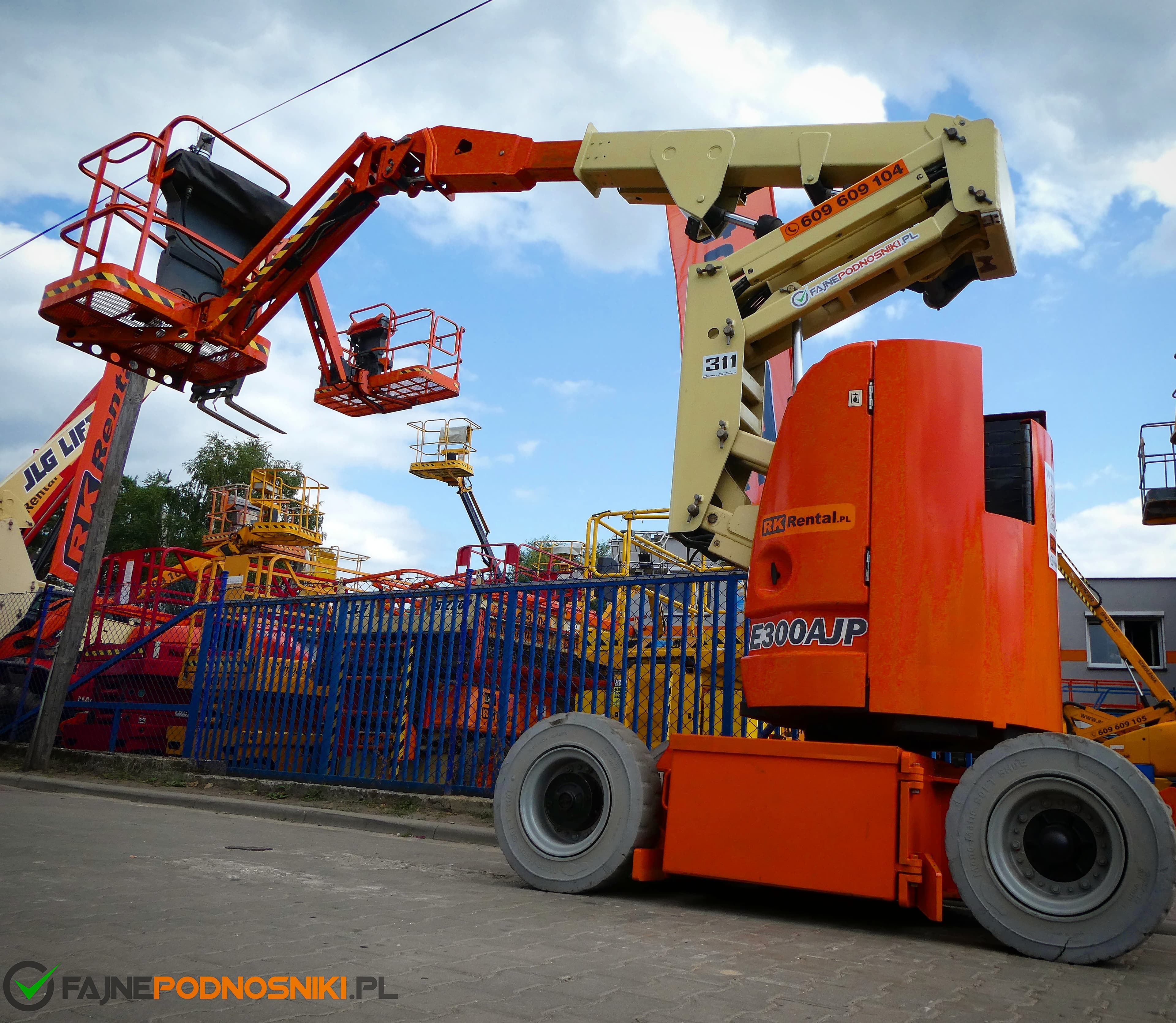 JLG E300AJP electric articulating boom lift (11 m) from RK Rental at the yard in Brzoza before delivery to a customer in Lipno