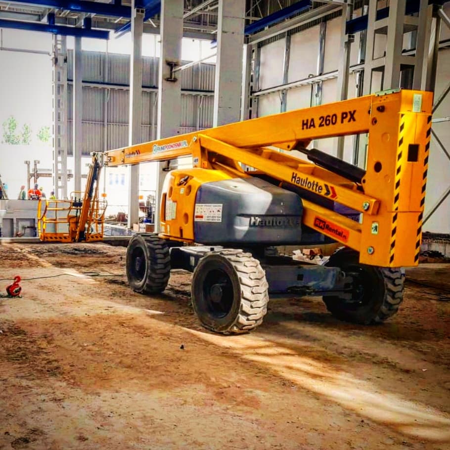 Haulotte HA260PX rough terrain articulating boom lift (26 m, 4×4) from RK Rental in a hall in Mogilno