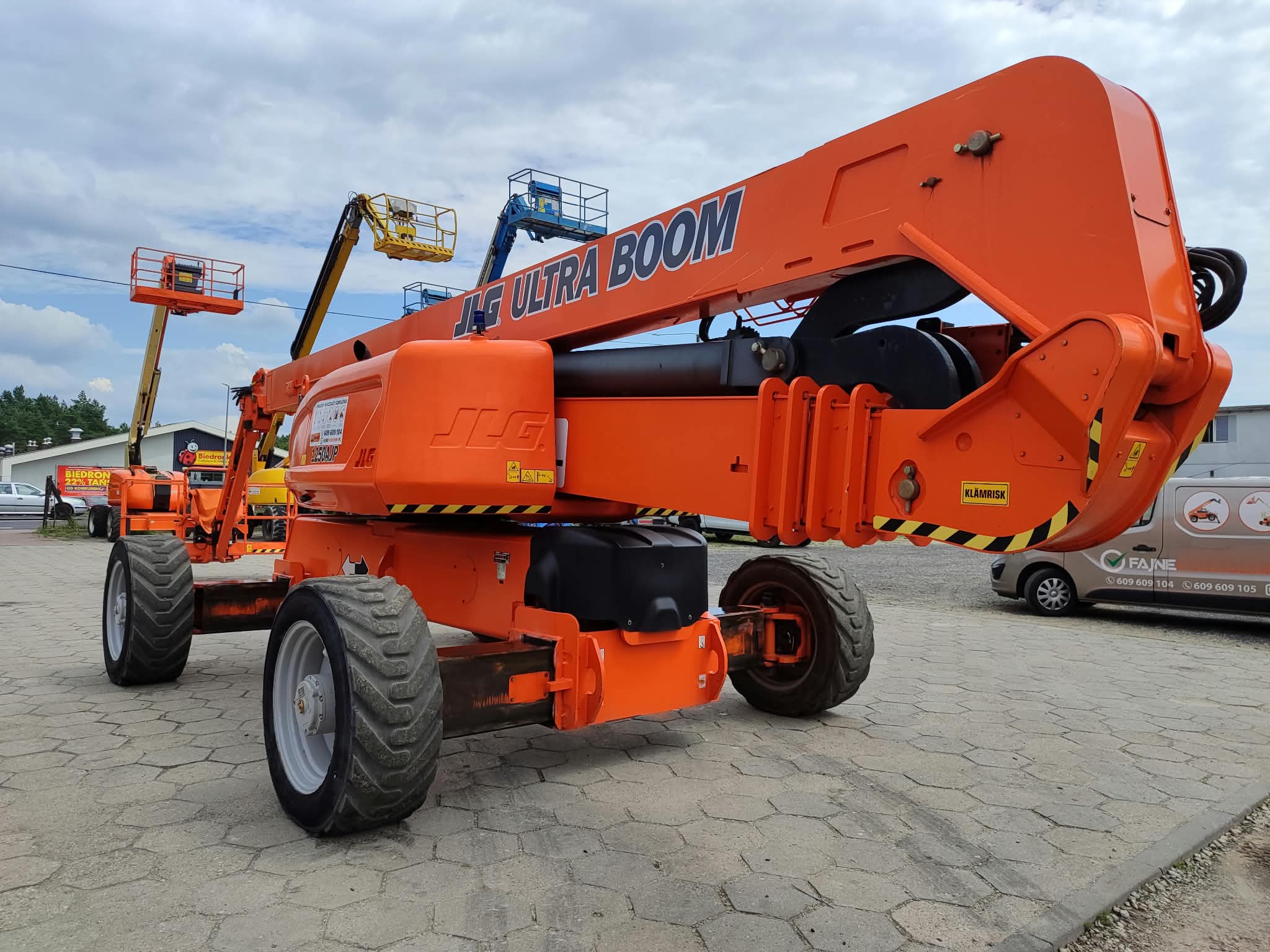 JLG 1250AJP UltraBoom articulating boom lift (approx. 40 m, 4×4) at the RK Rental base in Brzoza before delivery to a customer in Kutno