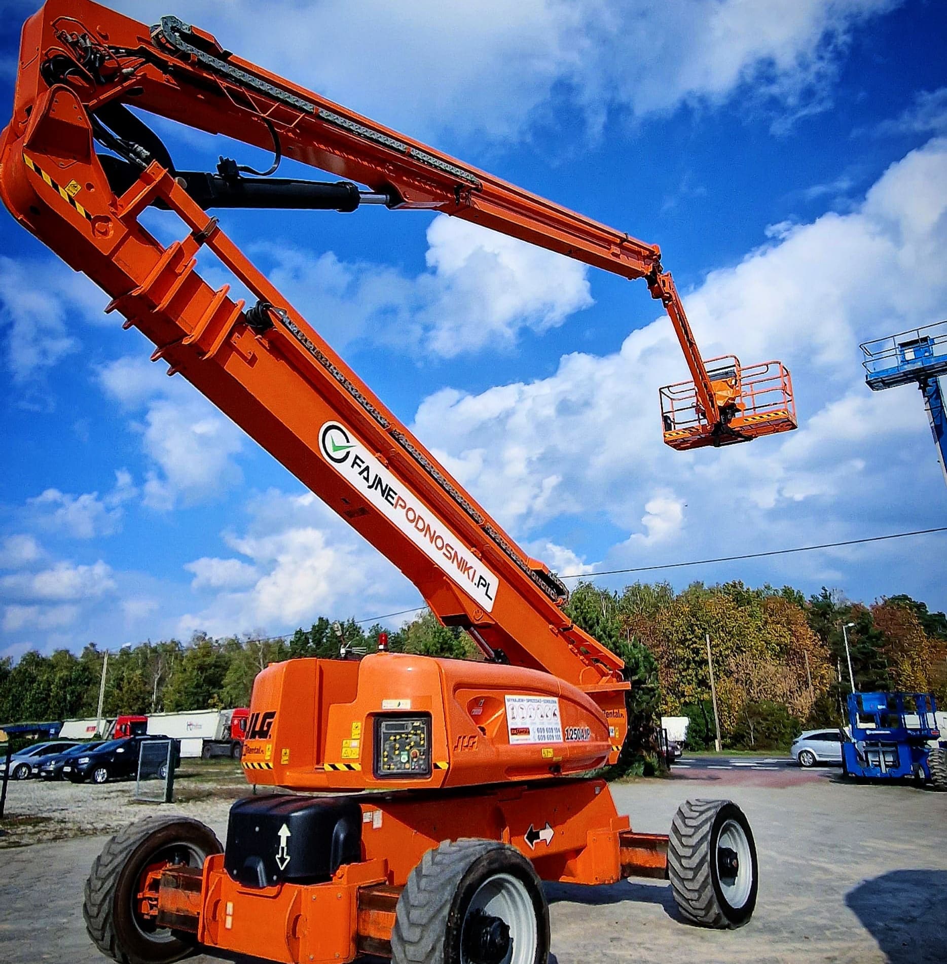 JLG 1250AJP UltraBoom articulating boom lift (approx. 40 m, 4×4) in the RK Rental base yard in Brzoza before delivery to a customer in Szczecin
