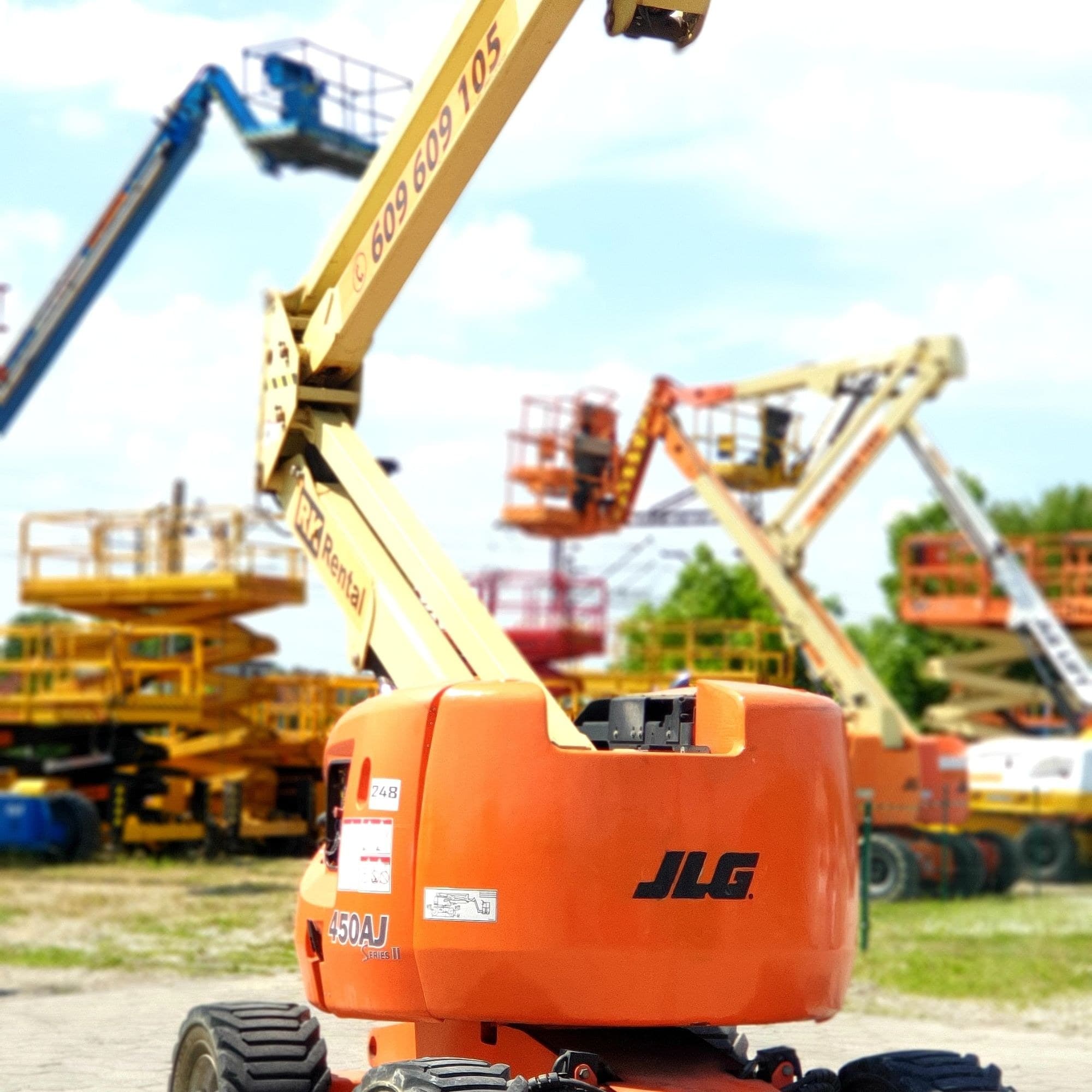 Rented JLG 450AJ Series II rough terrain articulating boom lift (diesel, 4×4, 16 m) from RK Rental prepared for a customer on long-term rental in Tuchola